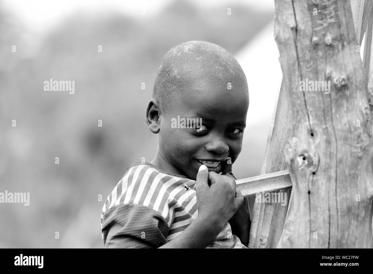 TORIT, SOUTH SUDAN-FEBRUARY 20 2013: Unidentified boy in the village of Torit, South Sudan. Children suffer poverty due to the unstable political situ Stock Photo