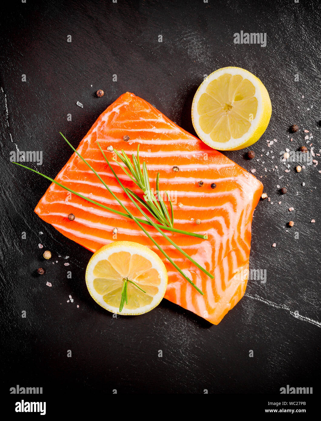 Juicy salmon fillet on black slate plate, top view Stock Photo - Alamy