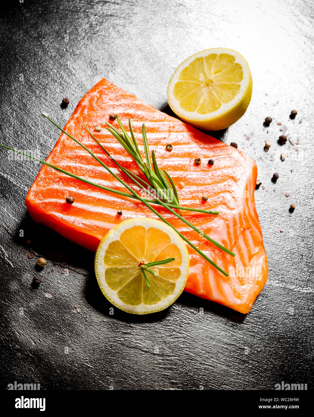 Juicy salmon fillet on black slate plate, top view Stock Photo - Alamy
