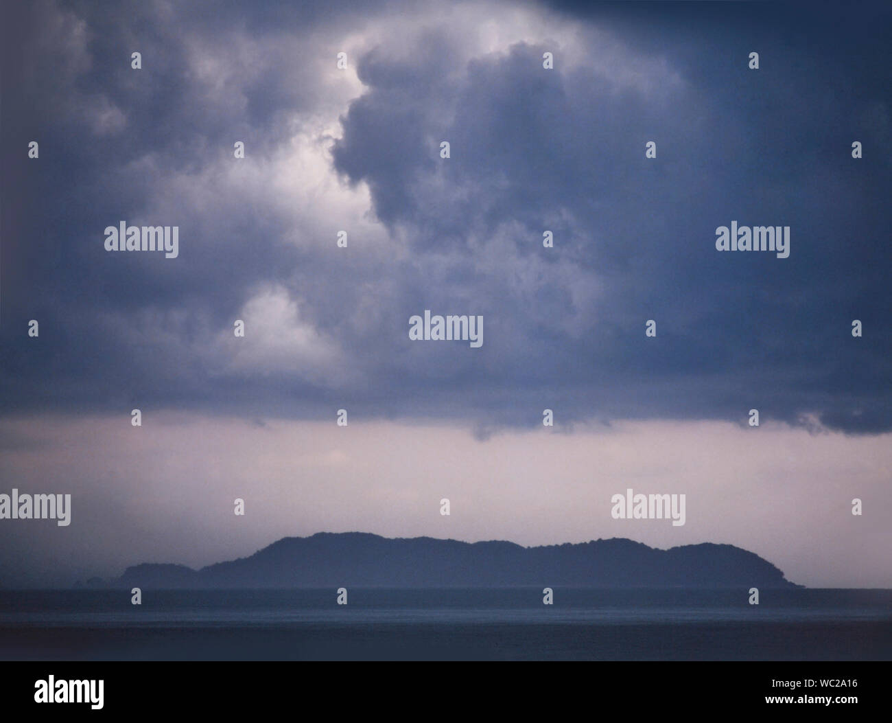 Gathering storm clouds over a tropical island, East coast Malaysia Stock Photo