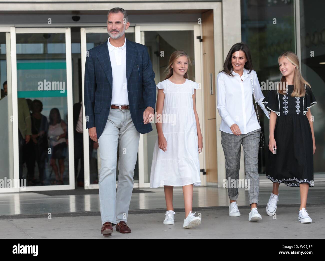 Madrid, Spain. 27th Aug, 2019. Felipe VI and Letizia Reyes de España speak with the press accompanied by their daughters Princess Leonor and the Infanta Sofia in the hospital after visiting King Juan Carlos I, who is recovering from an open heart operation. Credit: dpa picture alliance/Alamy Live News Stock Photo