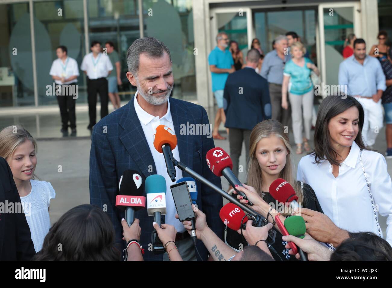 Madrid, Spain. 27th Aug, 2019. Felipe VI and Letizia Reyes de España speak with the press accompanied by their daughters Princess Leonor and the Infanta Sofia in the hospital after visiting King Juan Carlos I, who is recovering from an open heart operation. Credit: dpa picture alliance/Alamy Live News Stock Photo