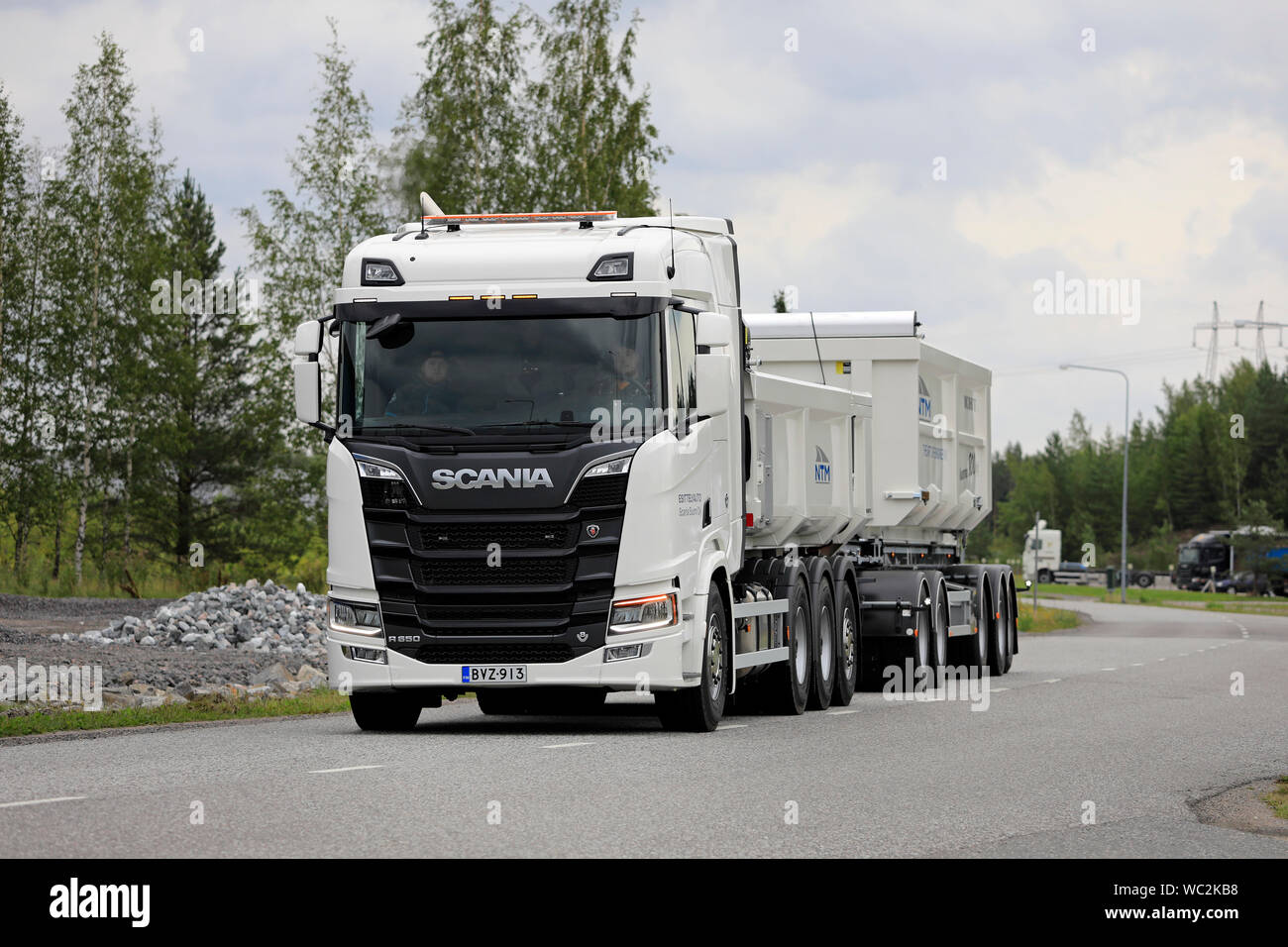 Turku, Finland. August 23, 2019. White Next Generation Scania R650 truck pulls gravel trailer on road test. Scania in Finland 70 years tour. Stock Photo
