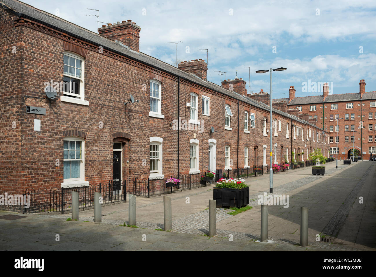 Traditional terraced houses on Anita Street in the Ancoats area of Manchester, UK. Stock Photo
