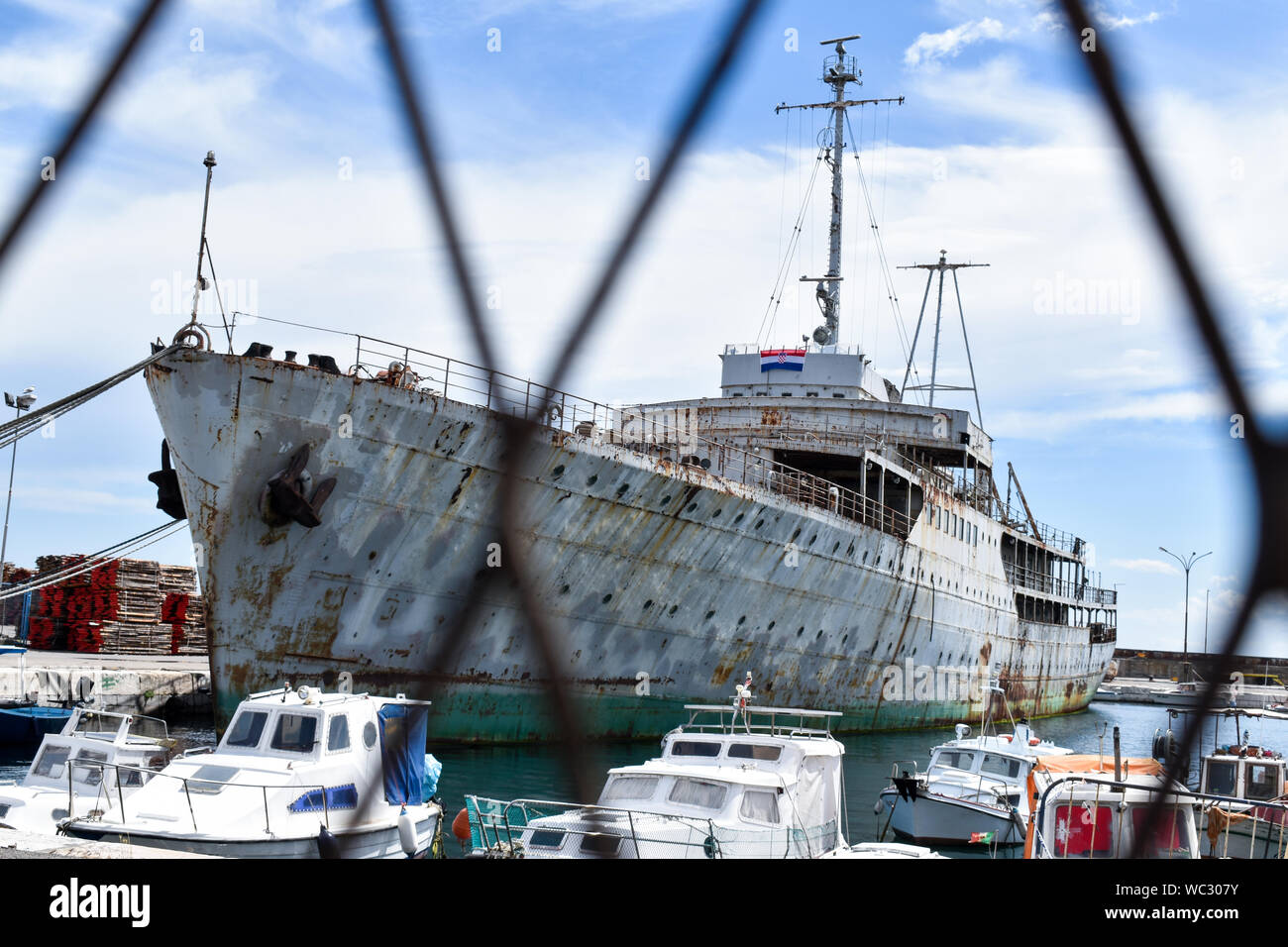 Abandoned rusty ship in Rijeka port, Croatia. Ship called Galeb previously owned by Josip Broz Tito, Yugoslav communist dictator. Stock Photo