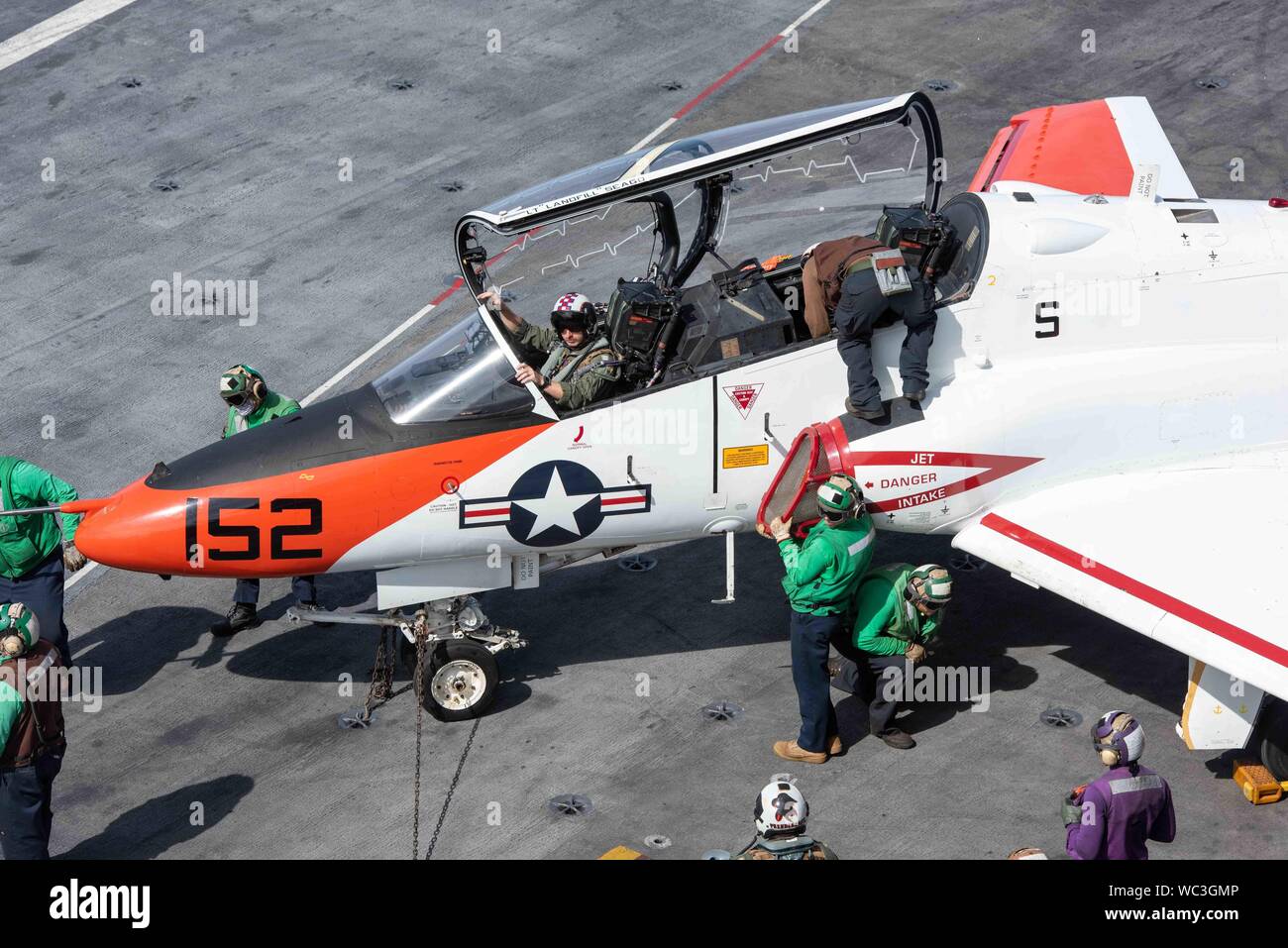 U.S. Sailors perform a turnaround inspection on a T-45C Goshawk training aircraft, assigned to Training Air Wing (TW) 1, on the flight deck of the aircraft carrier USS John C. Stennis (CVN 74) in the Atlantic Ocean, Aug. 24, 2019. The John C. Stennis is underway conducting carrier qualifications in support of Chief of Naval Air Training Command. (U.S. Navy photo by Lt. Anthony J. Ivester) Stock Photo