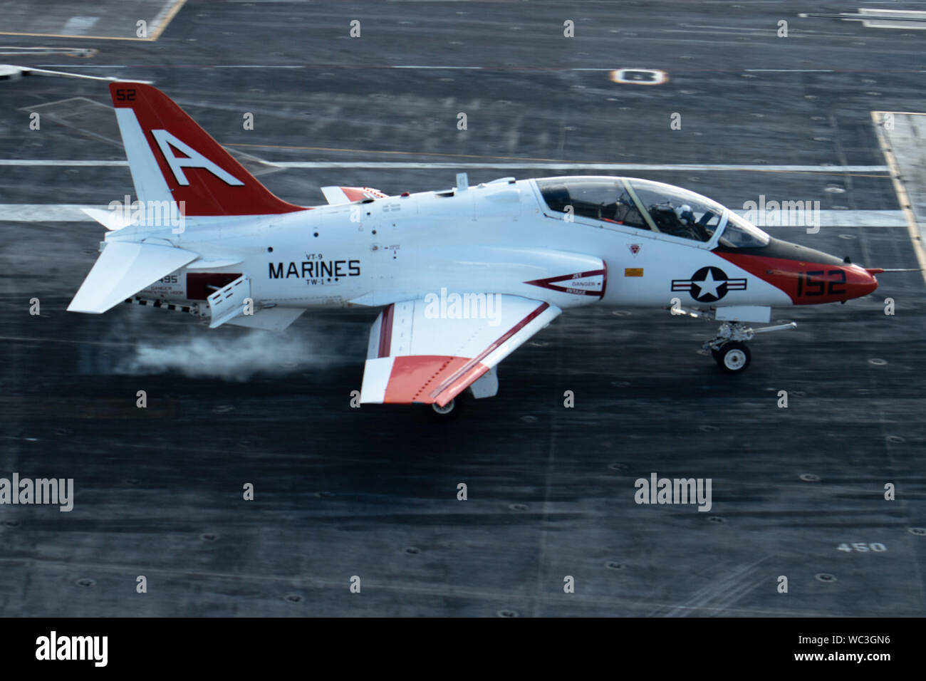 A T-45C Goshawk training aircraft, assigned to Training Air Wing (TW) 1, performs a touch-and-go on the flight deck of the aircraft carrier USS John C. Stennis (CVN 74) in the Atlantic Ocean, Aug. 24, 2019. The John C. Stennis is underway conducting carrier qualifications in support of Chief of Naval Air Training Command. (U.S. Navy photo by Mass Communication Specialist 3rd Class Rebekah M. Rinckey) Stock Photo