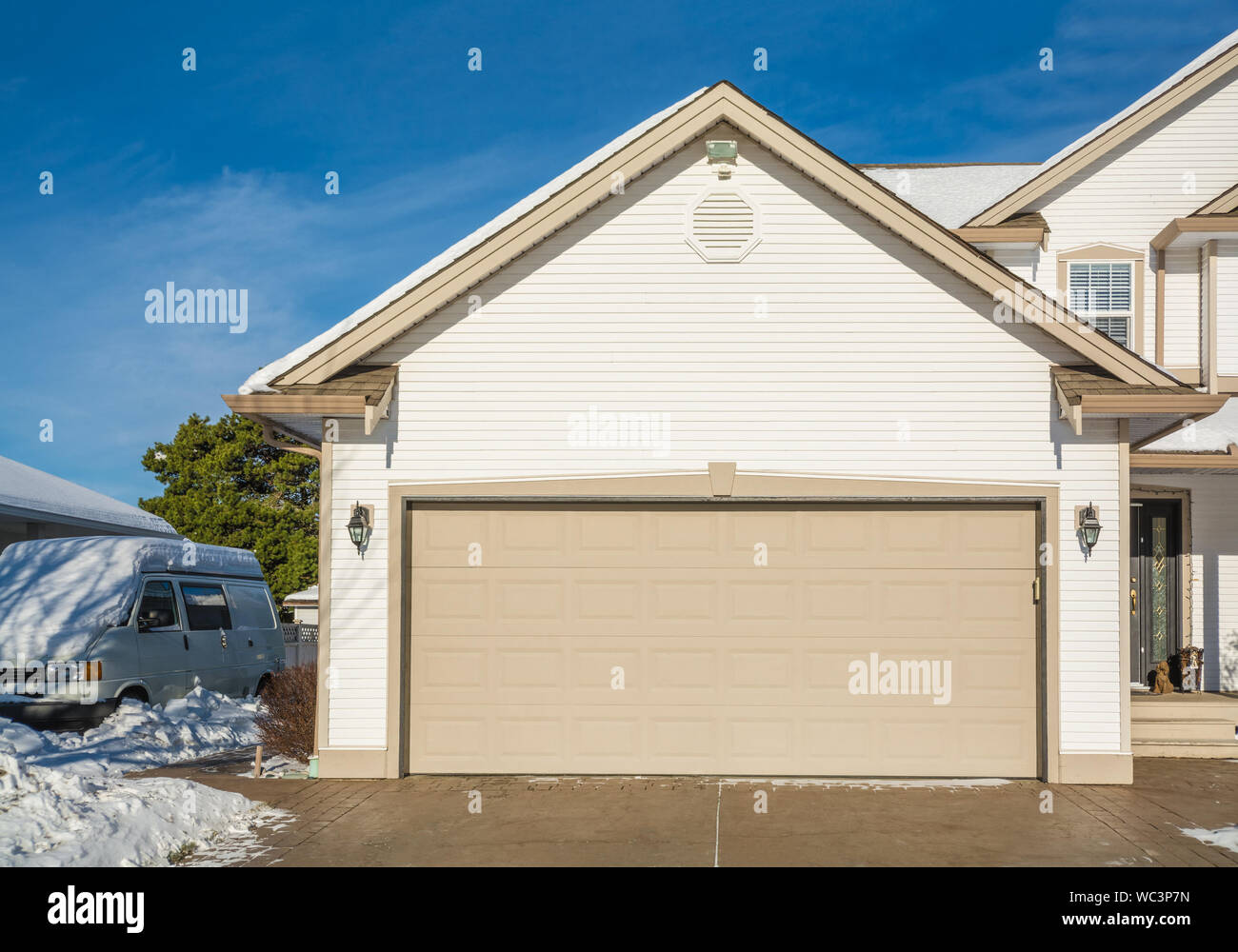 Wide Garage Door Of Luxury House With Rv Wagon Parked Nearby Stock