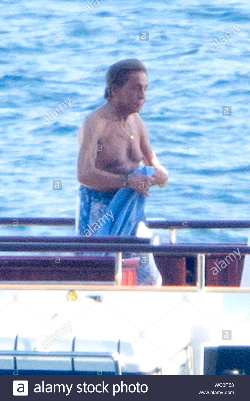 Capri, Italy - Renowned fashion designer Valentino Garavani and president  of the Valentino Fashion House, Giancarlo Giammetti, enjoy a relaxing day  in Capri, Italy. The pair sunbathed on a yacht with an