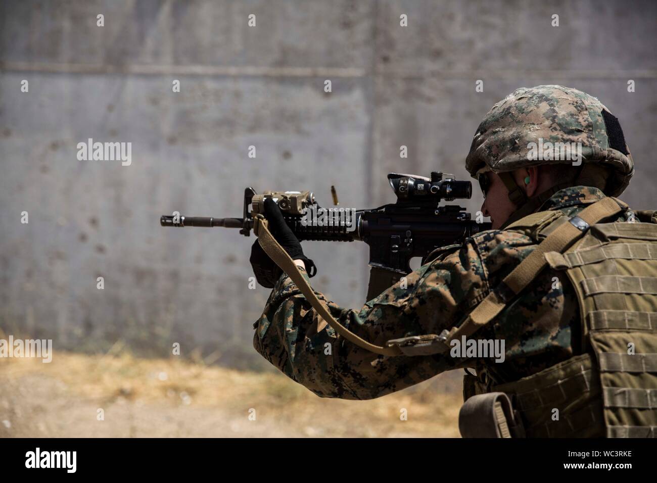 A U.S. Marine with Special Purpose Marine Air-Ground Task Force-Crisis Response-Africa 19.2, Marine Forces Europe and Africa, fires an M4 carbine during a table four range on Moron Air Base, Spain, Aug. 23, 2019. The Ground Combat Element maintains weapons handling procedures to increase proficiency as a crisis-response force. SPMAGTF is deployed to conduct crisis-response operations in Africa and promote regional stability by conducting military-to-military training exercises throughout Europe and Africa. (U.S. Marine Corps photo by Cpl. Margaret Gale) Stock Photo