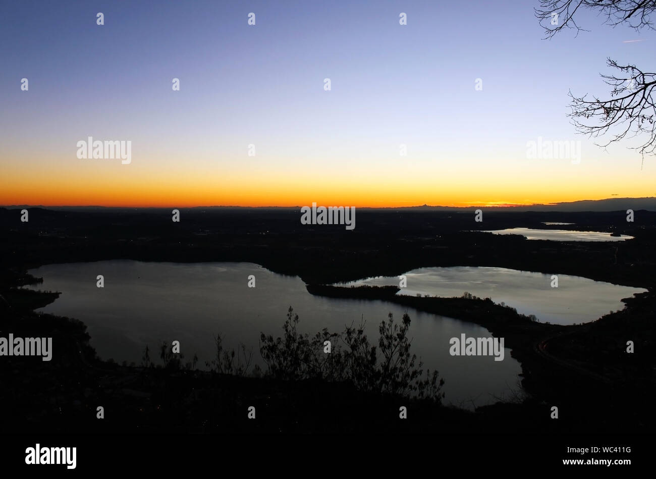 Annone lake at sunset from monte Barro (northern Lombardy) during a clear sky autumn night Stock Photo