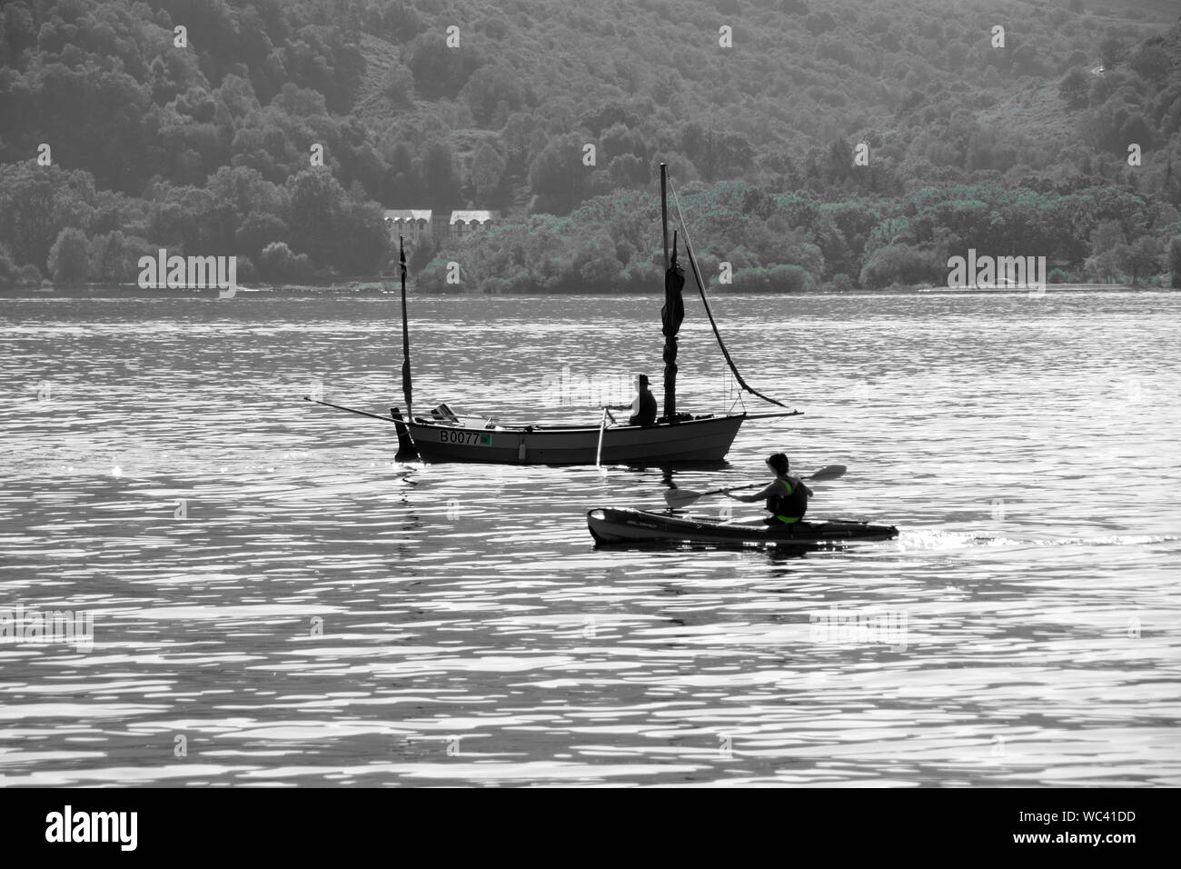 Boat and canoe sailing on Loch Lomond at Rowardennan Stock Photo Alamy