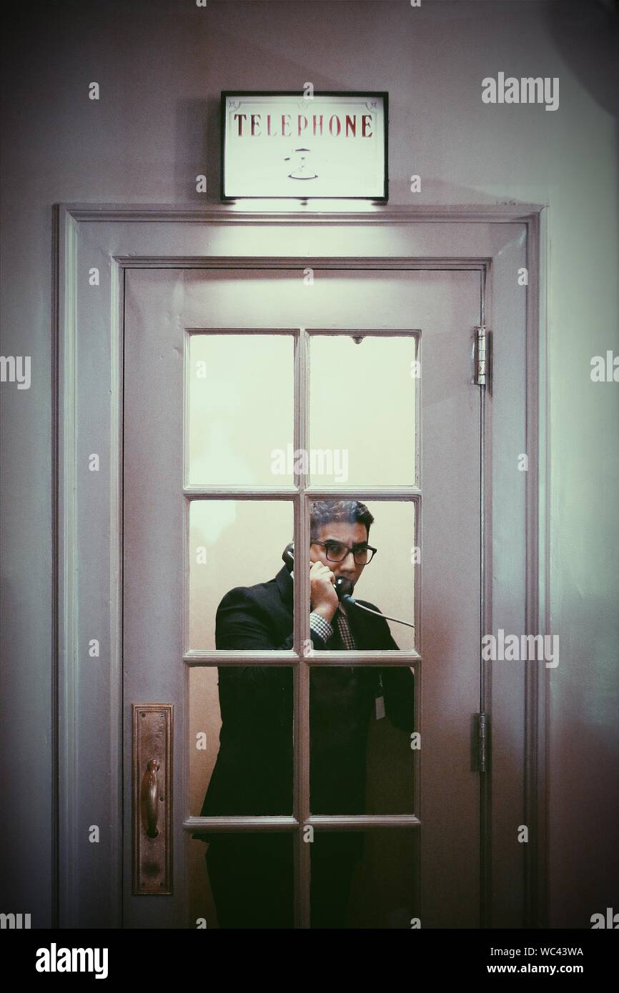 Man in telephone booth hi-res stock photography and images - Alamy