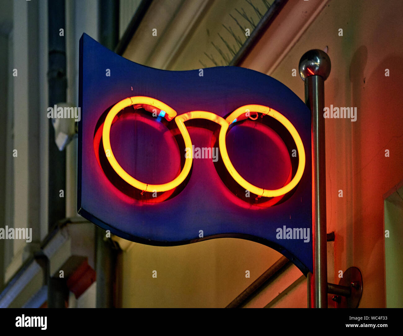 Glasses as a neon sign for an optician Stock Photo - Alamy