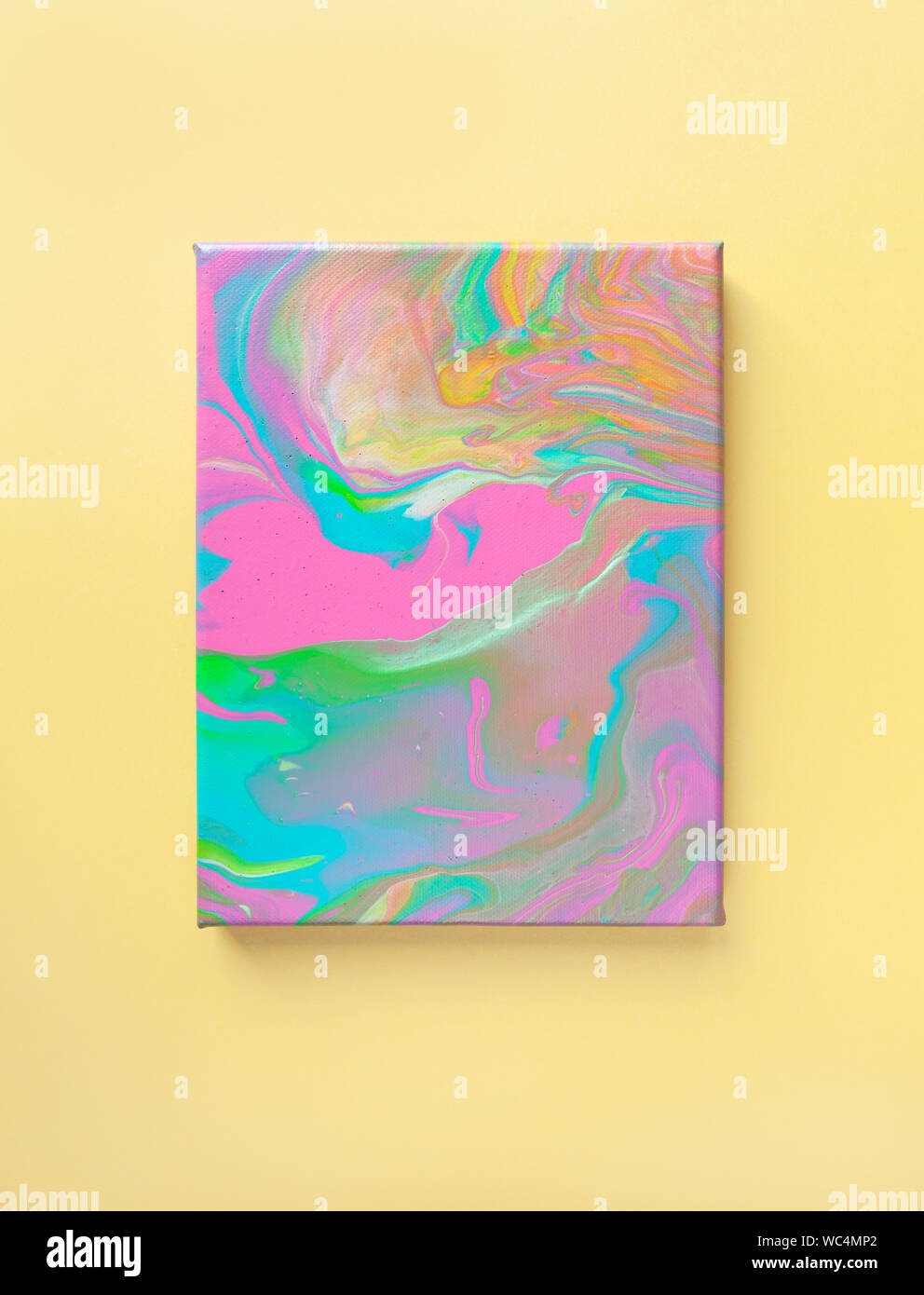 Painting in bright pastel colors on wall using liquid fluid art trendy