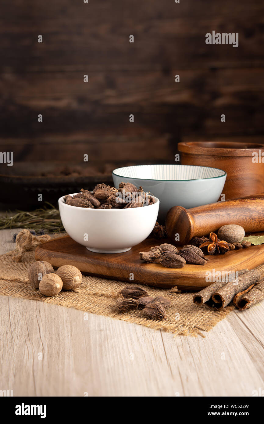 Black Indian Cardamon Pods in a bowl and food preparation and kitchen ...