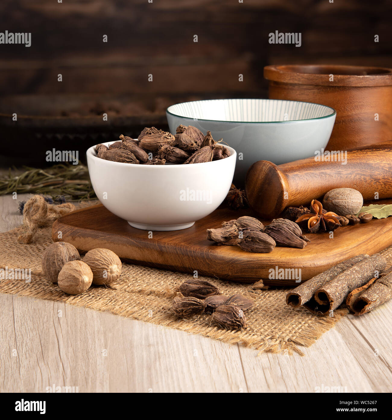 Black Indian Cardamon Pods in a bowl and food preparation and kitchen ...