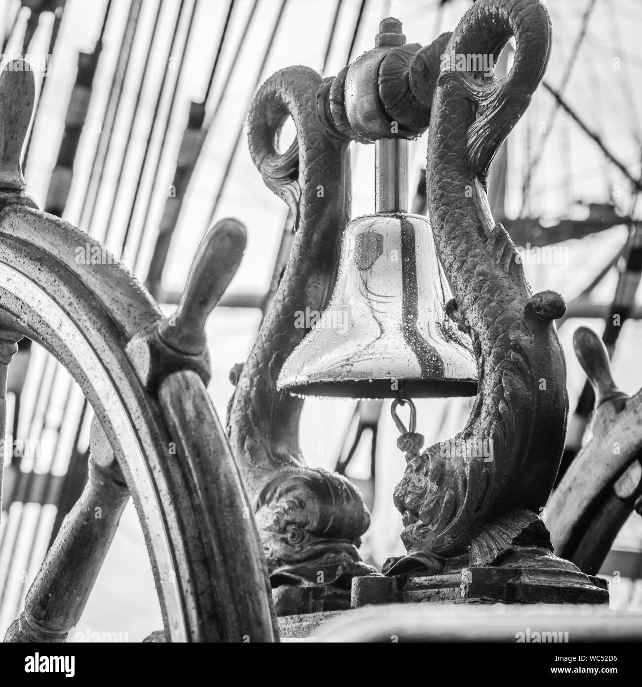 Ship's Bell and wheel the old sailboat, close-up Stock Photo
