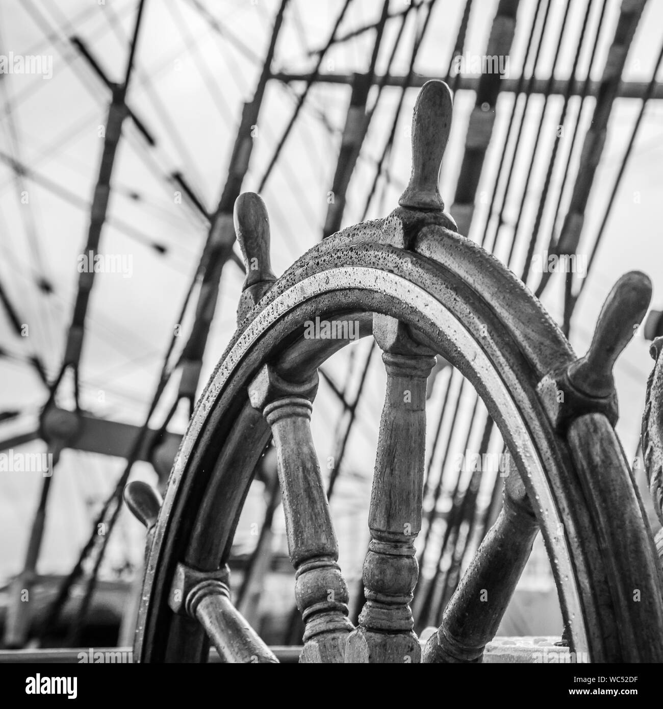 Ship's Bell and wheel the old sailboat, close-up Stock Photo