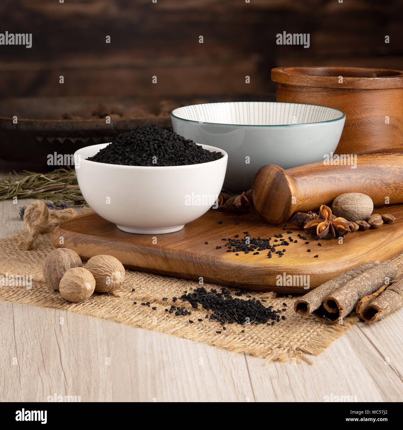 Nigella Seeds in a bowl and food preparation and kitchen setting Stock Photo