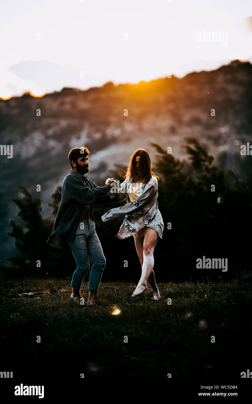 Young beautiful barefoot couple dancer practicing modern dance Stock Photo
