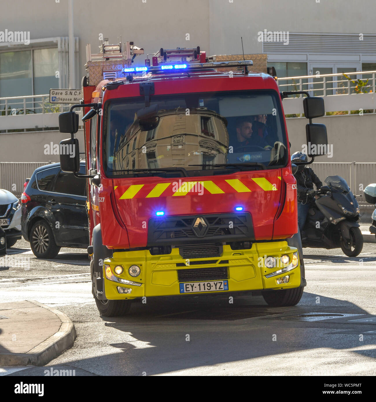 CANNES, FRANCE - APRIL 2019: Head on view of a fire truck with blue ...