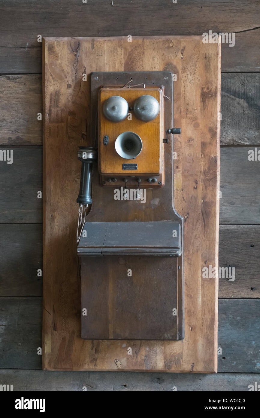 Old telephone mounted on wall hi-res stock photography and images - Alamy