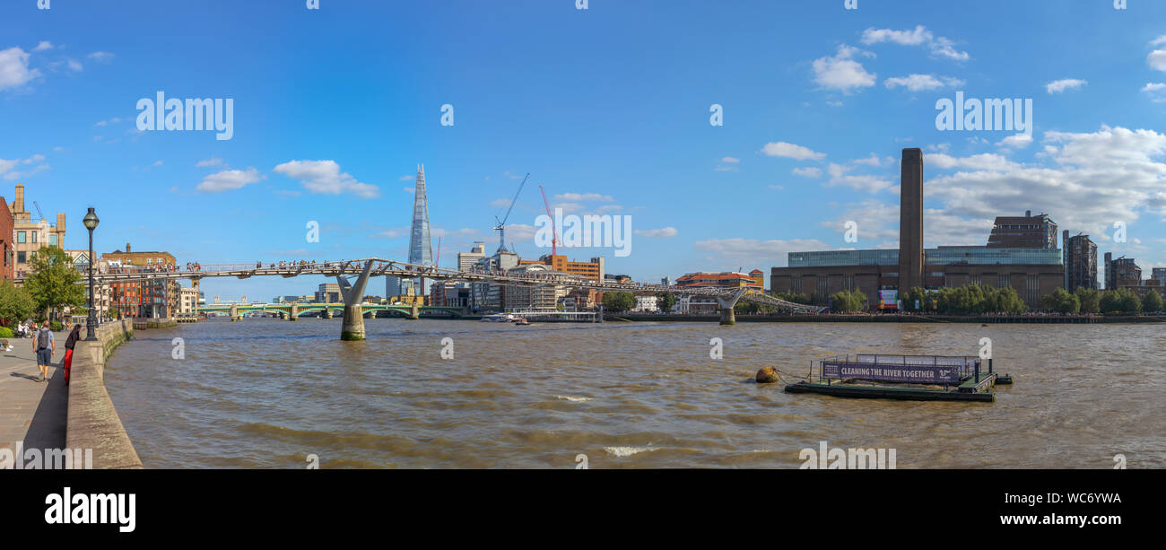 View from Thames Walk on the North Bank over the River Thames over Millennium Bridge to the Shard, with Tate Modern on the South Bank, London SE1 Stock Photo