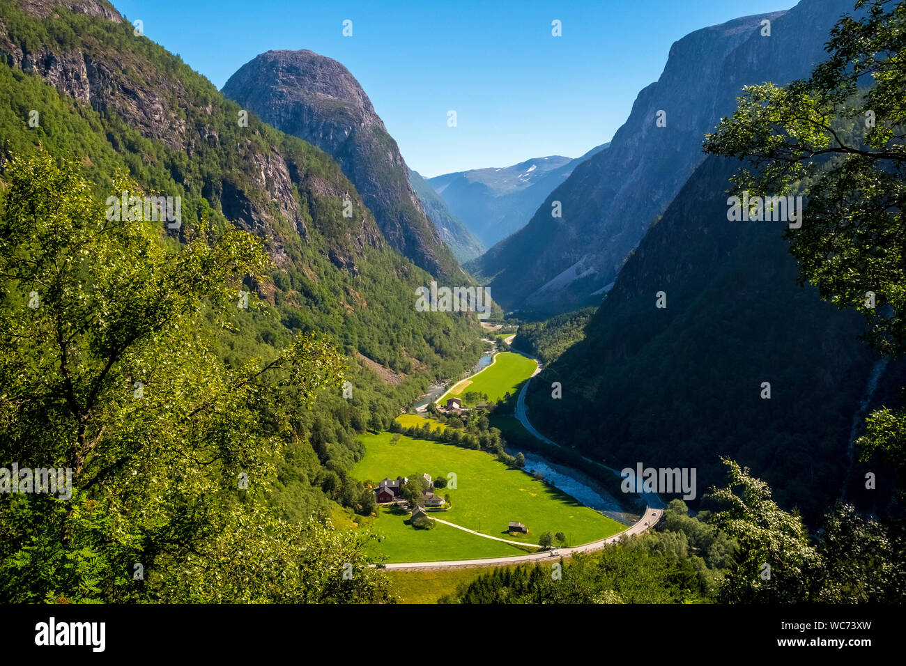 valley, green meadows, path, rock faces, blue sky, Stalheim, Hordaland, Norway, Scandinavia, Europe, NOR, travel, tourism, destination, sightseeing, s Stock Photo