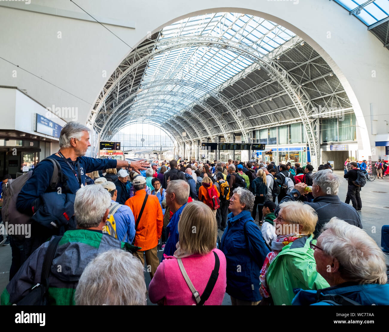 Tourists at the railway station of Bergen, tour guide, glass dome roof, train, Bergen, Hordaland, Norway, Scandinavia, Europe, NOR, travel, tourism, d Stock Photo