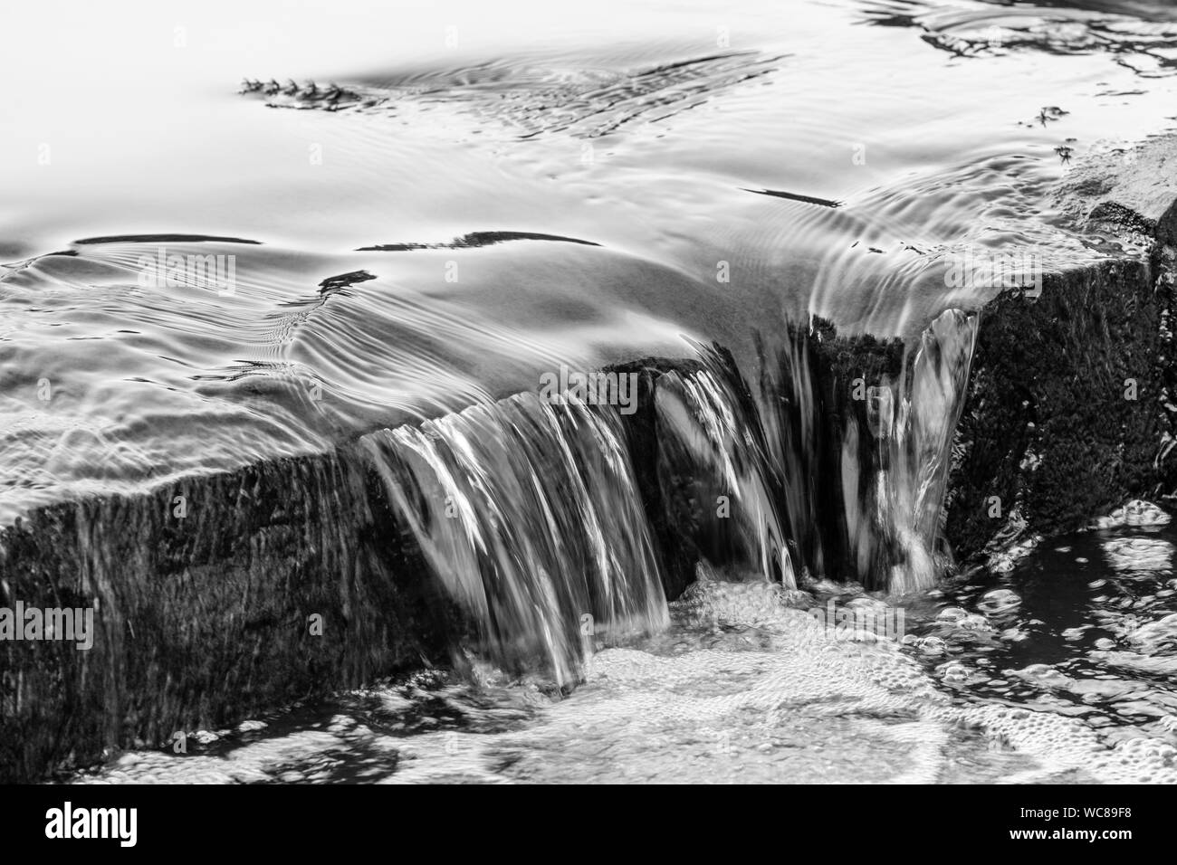 Water Falling From Rocks In River Stock Photo Alamy