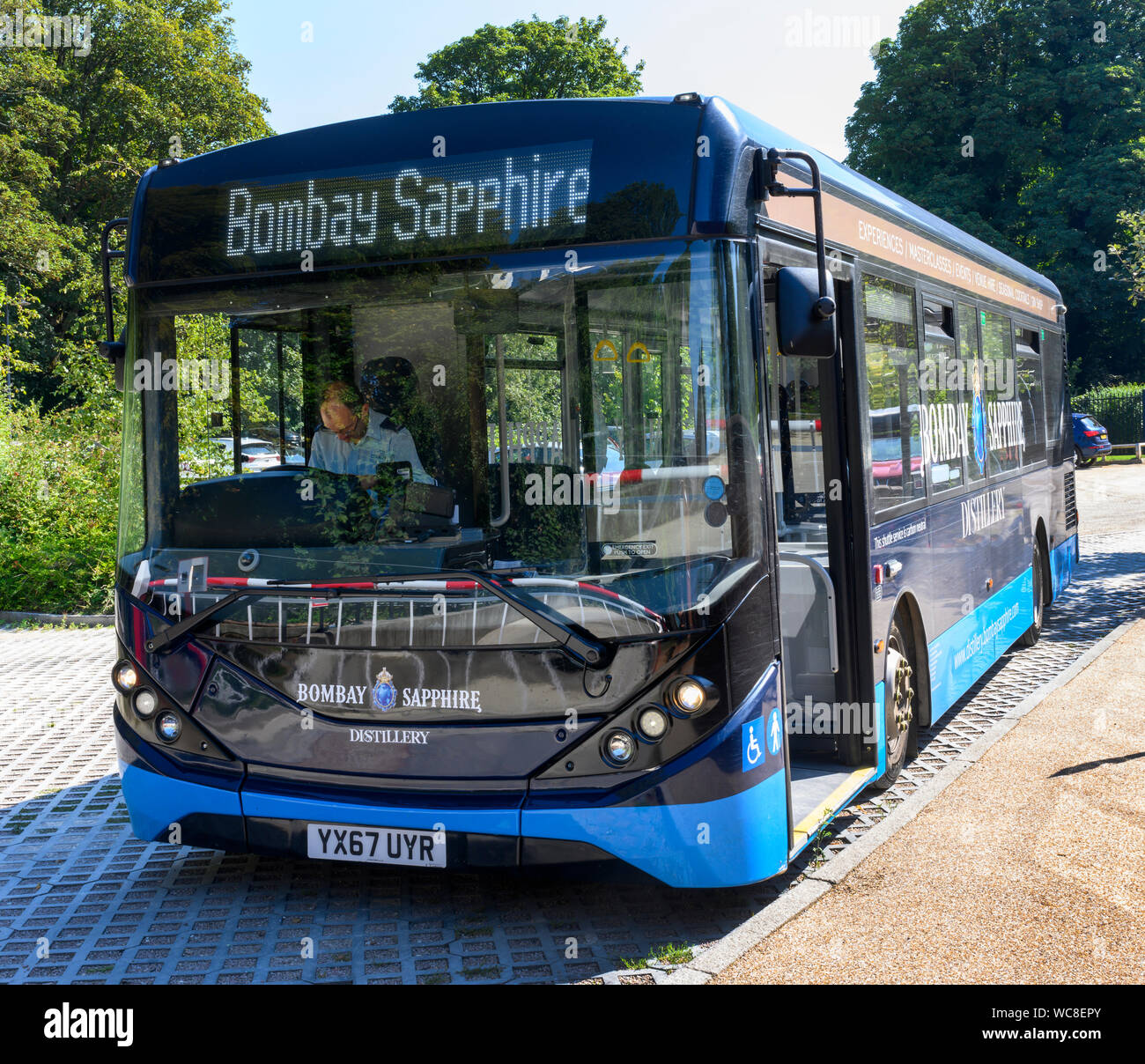 Single decker bus used by Bombay Sapphire Distillery to transport tourist and visitors to their Gin Distillery at Laverstoke, Hampshire, England, UK Stock Photo