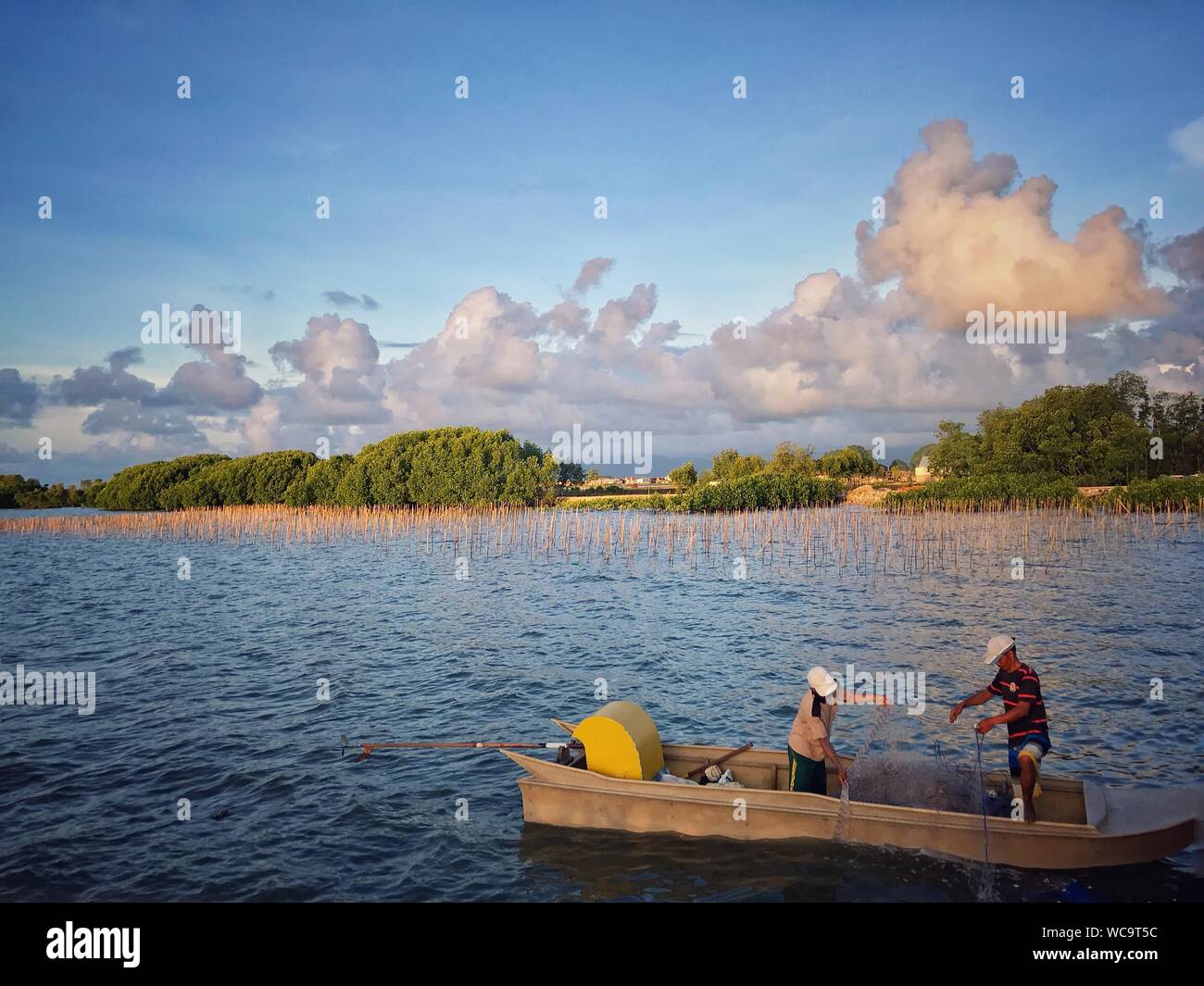 Two people fishing in boat hi-res stock photography and images - Alamy