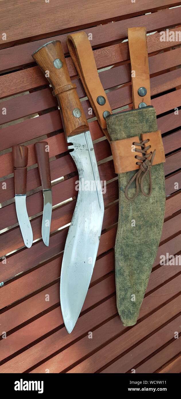 Traditional Gurkha kukhri knife with scabbard and accessory knives. Stock Photo