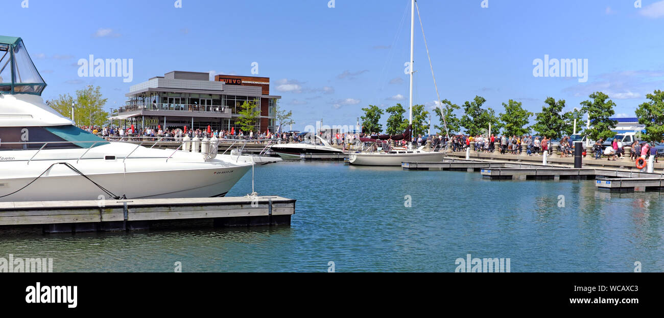 Summer crowds fill the Northcoast Harbour perimeter in downtown Cleveland, Ohio, USA. Stock Photo