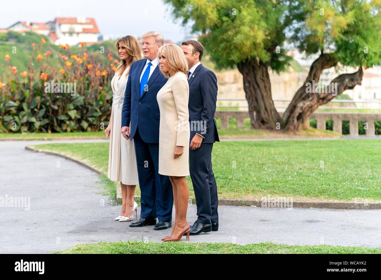 U.S. President Donald Trump and French President Emmanuel Macron pose together on arrival to the G7 Leaders’ Dinner at the Biarritz Lighthouse August 24, 2019 in Biarritz, France. Standing from left to right are: U.S. First Lady Melania Trump, U.S. President Donald Trump, French President Emmanuel Macron and French First Lady Brigitte Macron. Stock Photo