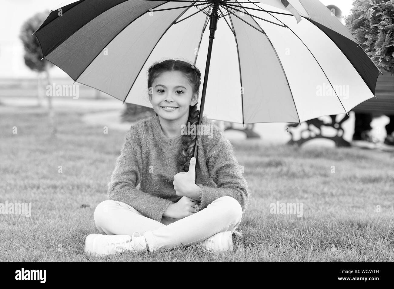 Everything better with my umbrella. Colorful accessory for cheerful mood. Girl child long hair with umbrella. Colorful accessory positive influence. Bright umbrella. Stay positive and optimistic. Stock Photo