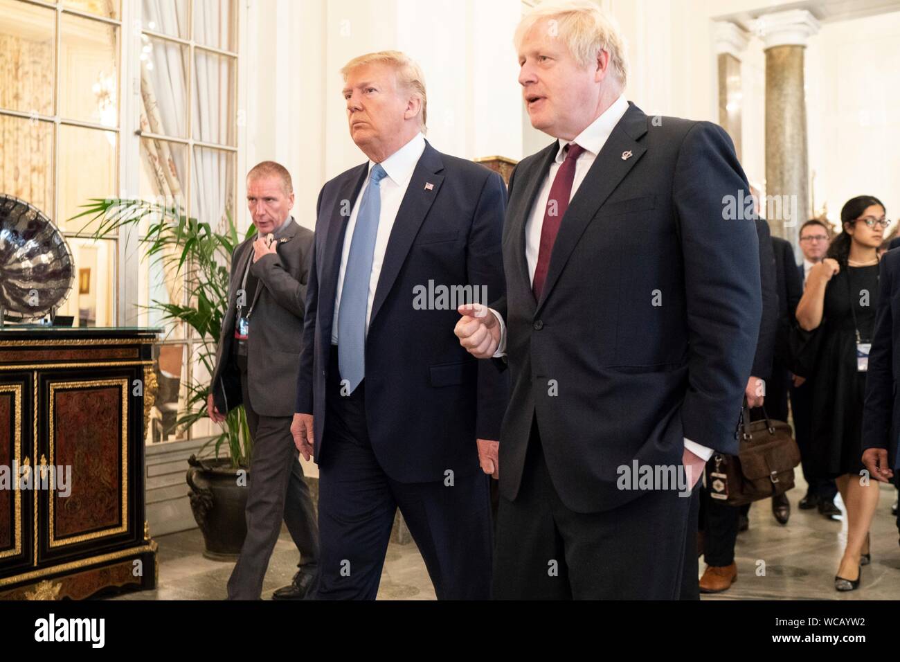 U.S. President Donald Trump, left, walks with British Prime Minister Boris Johnson following their meeting on the sidelines of the G7 Summit at the Hotel du Palais Biarritz August 25, 2019 in Biarritz, France. Stock Photo