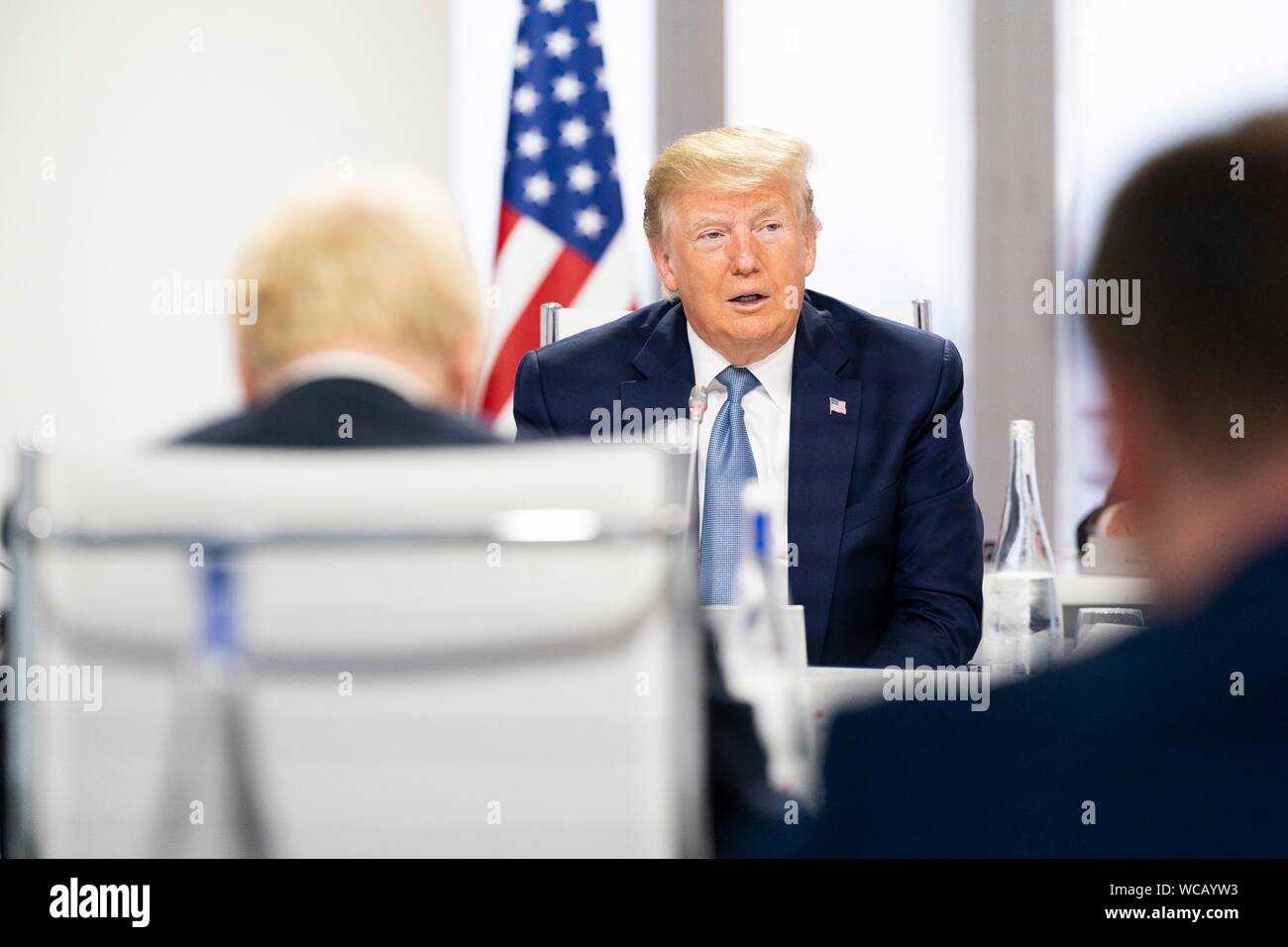 U.S. President Donald Trump delivers remarks to other world leaders during the G7 Working Session on the Global Economy, Foreign Policy and Security Affairs at the Centre de Congrés Bellevue August 25, 2019 in Biarritz, France. Stock Photo