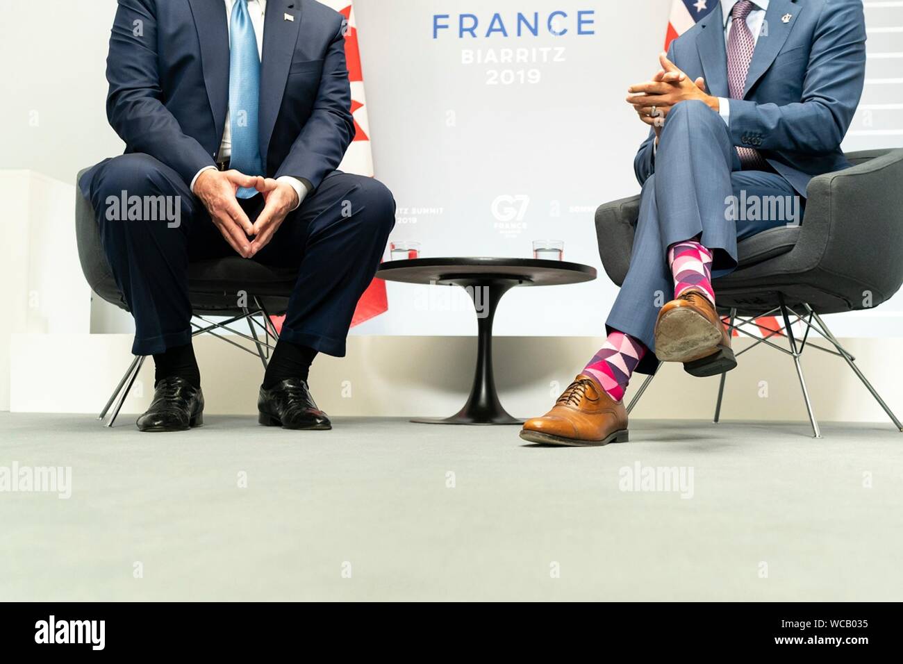 A contrast in style showing the colorful socks worn by Canadian Prime Minister Justin Trudeau, right, and those worn by U.S. President Donald Trump prior to their bilateral meeting on the sidelines of the G7 Summit at the Centre de Congrés Bellevue August 25, 2019 in Biarritz, France. Stock Photo