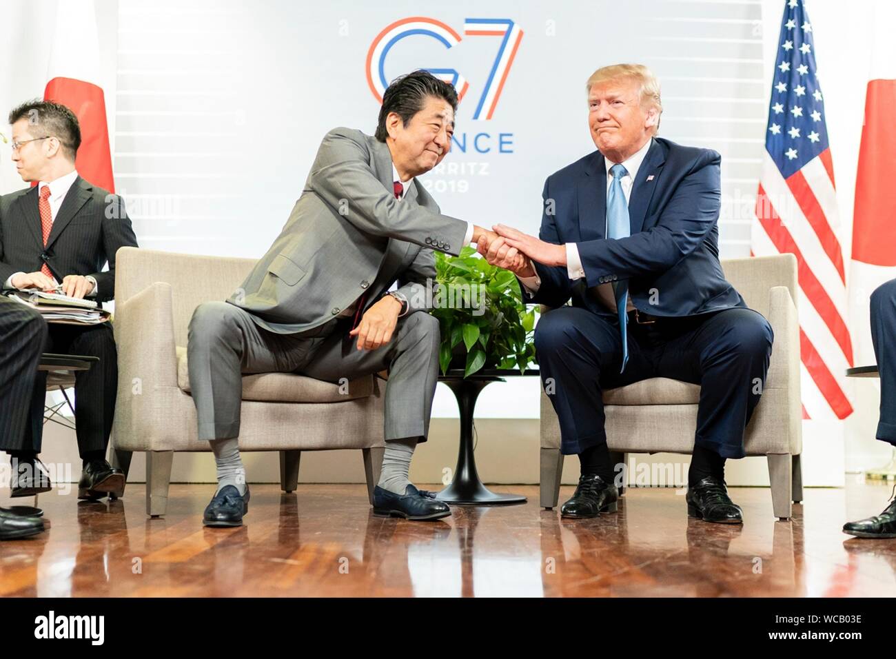 U.S. President Donald Trump shakes hands with Japanese Prime Minister Shinzo Abe, left, prior to their trade meeting on the sidelines of the G7 Summit at the Centre de Congrés Bellevue August 25, 2019 in Biarritz, France. Stock Photo