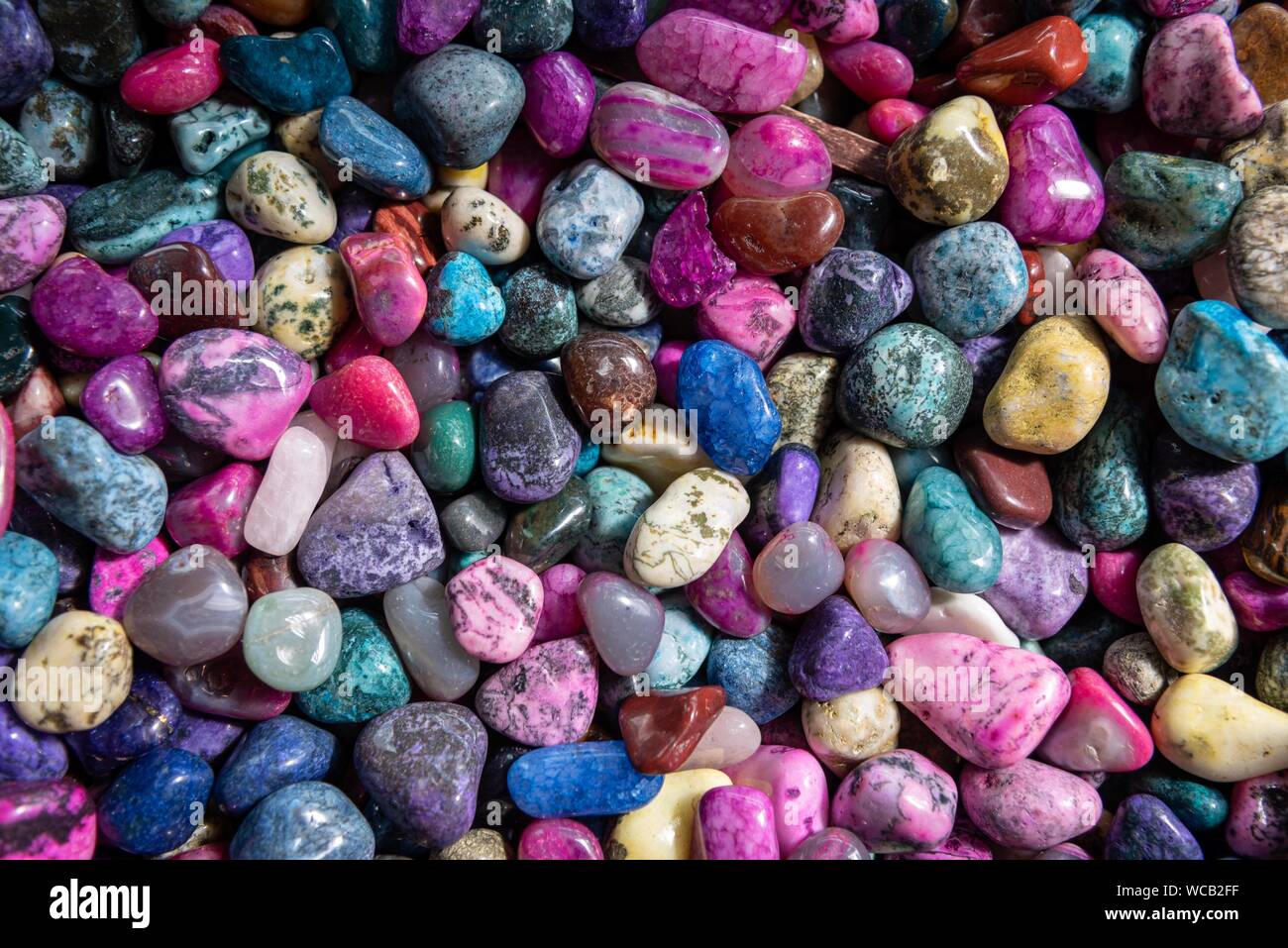 Collection of colorful pebbles background. Stock Photo