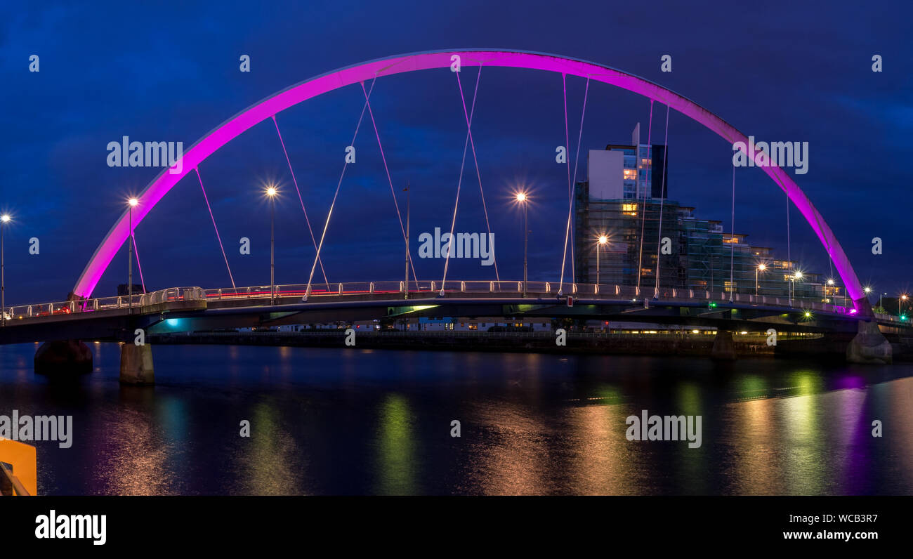 The Clyde Arc bridge over the river Clyde at night on July 21, 2017 in Glasgow, Scotland. Glaswegians call the bridge the 'Squinty Bridge'. Stock Photo