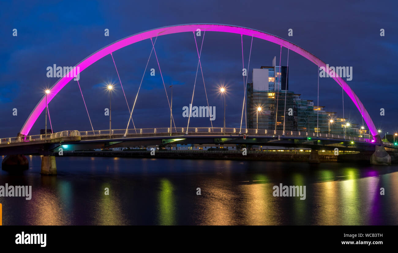 The Clyde Arc bridge over the river Clyde at night on July 21, 2017 in Glasgow, Scotland. Glaswegians call the bridge the 'Squinty Bridge'. Stock Photo