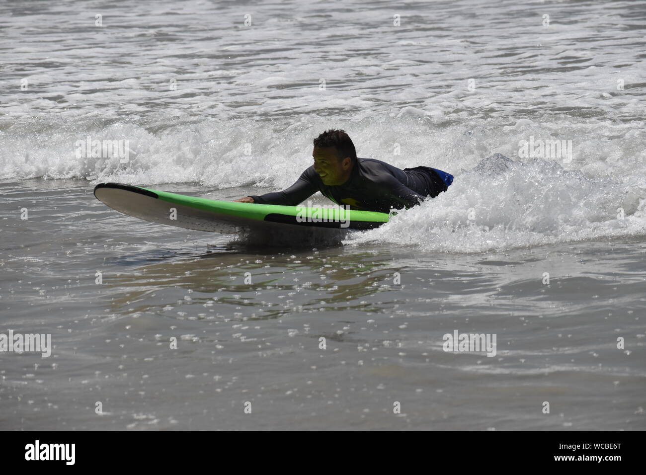 Surfing at Stinky's, Punta de Mita, Mexico Stock Photo