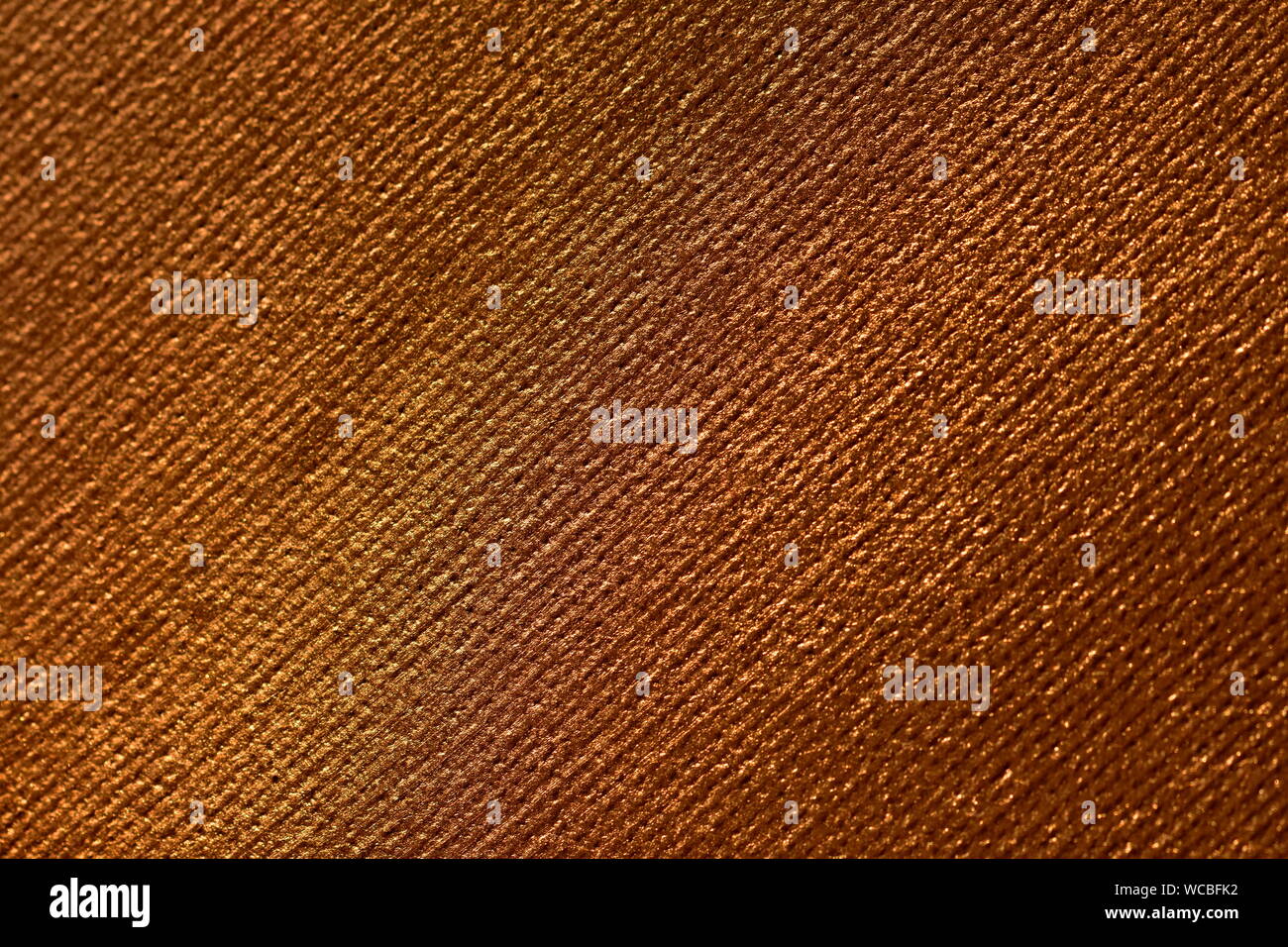 Old gold or copper canvas textured background closeup Stock Photo