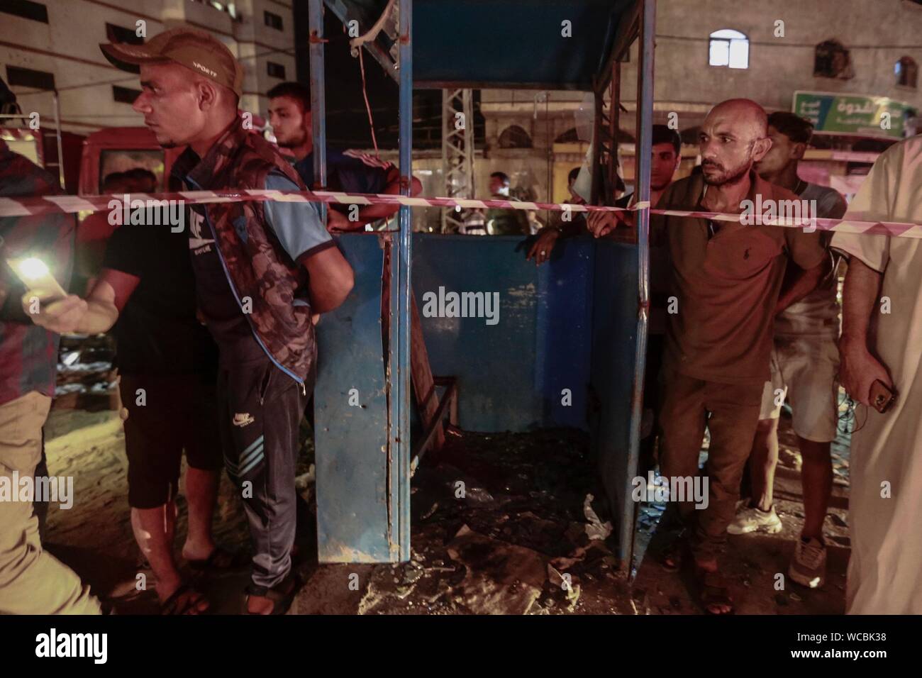 Gaza, Palestine. Autonomous Areas. 27th Aug, 2019. Palestinians are standing near the site of an explosion. According to the radical Islamic Hamas, two Palestinian policemen died in an explosion south of the city of Gaza. Credit: Mohammed Talatene/dpa/Alamy Live News Stock Photo