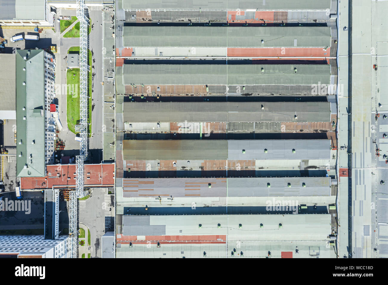 roof of large warehouse at city industrial area, aerial top view Stock Photo