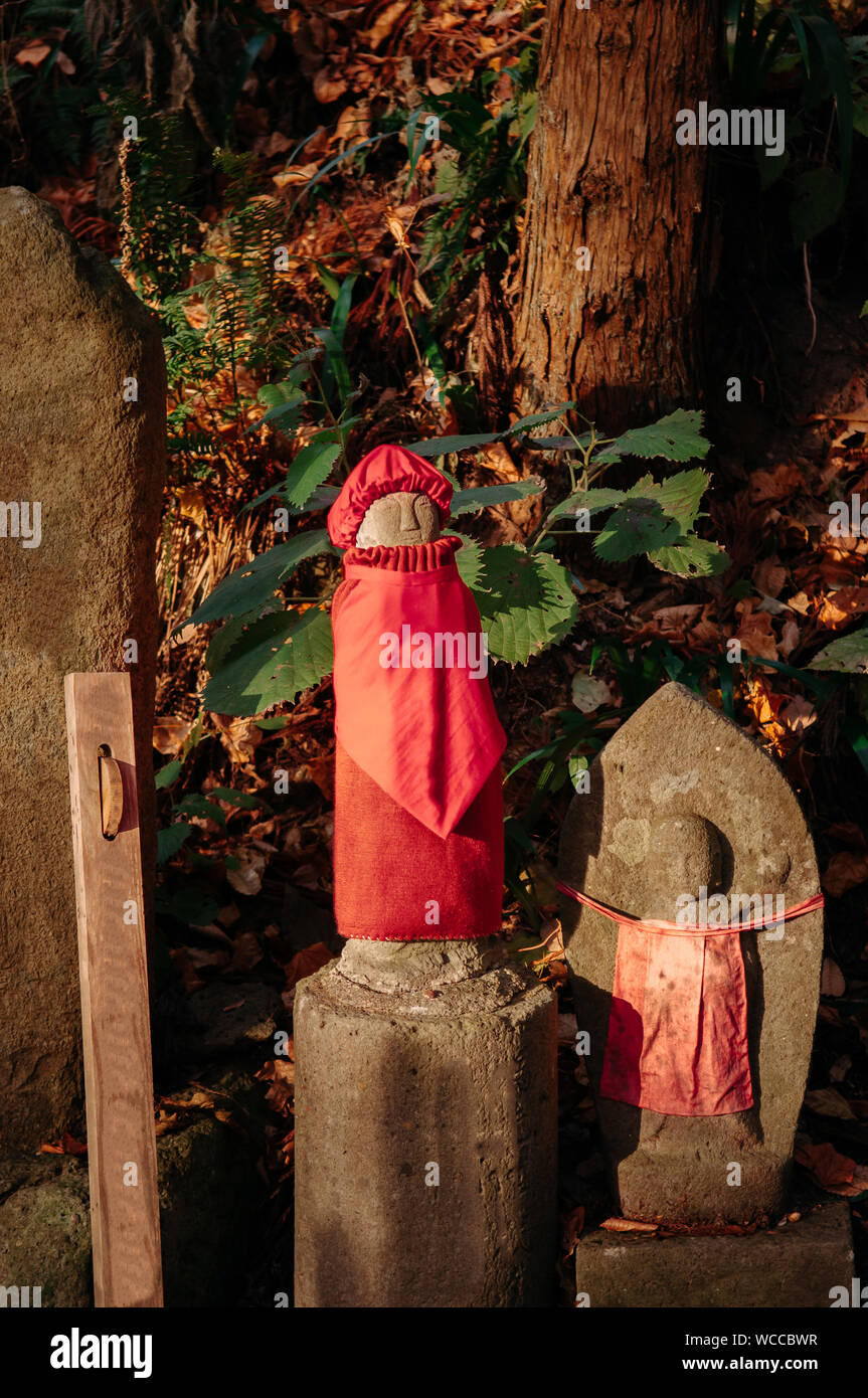 Jizo Bosatsu stone monk statues with bib and hat at Yamadera temple