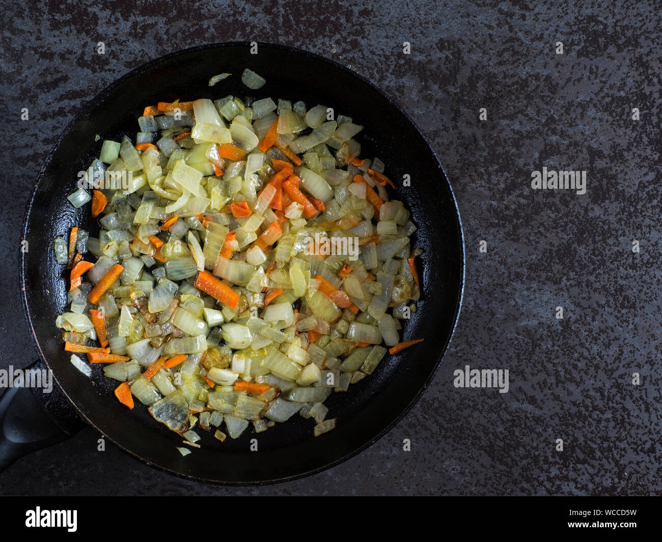 Directly Above Shot Of Cooked Onions And Carrots In Pan On Table Stock Photo